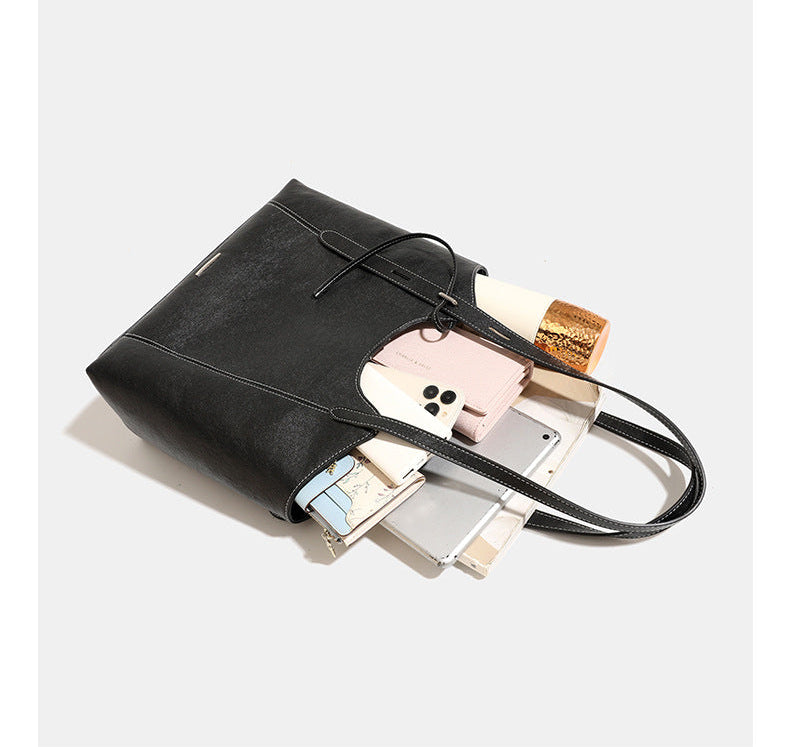 Structured open-top leather-look tote bag with long shoulder straps, contrast stitching, and side tie details, detail view 14