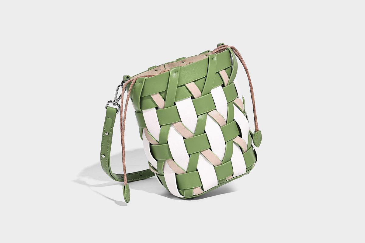 Small woven lattice bucket bag in tan and cream leather-look strips with drawstring top and detachable crossbody strap