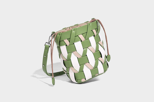 Small woven lattice bucket bag in tan and cream leather-look strips with drawstring top and detachable crossbody strap