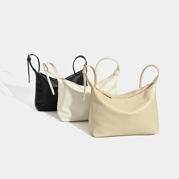 Soft slouchy zip shoulder crossbody bag with smooth matte leather-look finish and gold-tone hardware, detail view 2
