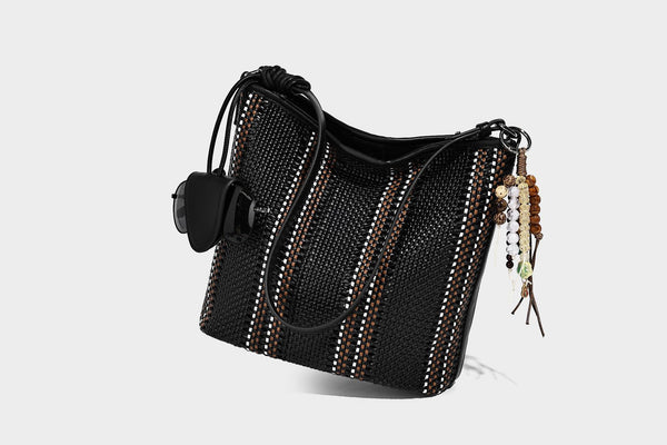 Woven bucket shoulder bag with leather-look trim, silver-tone hardware, and beaded tassel charm, detail view 28
