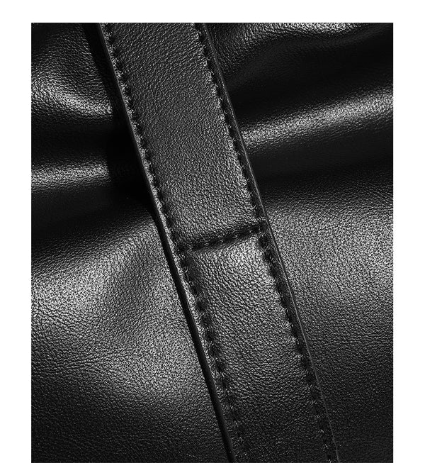 Soft slouchy hobo shoulder bag with smooth leather-look finish, gold-tone buckle and tab hardware, and long adjustable strap