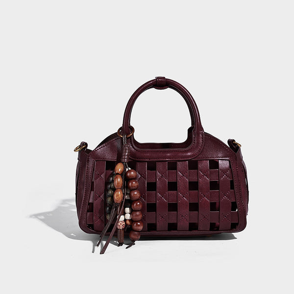 Small structured woven lattice top-handle satchel bag with bead-and-tassel charm and gold-tone hardware, detail view 9