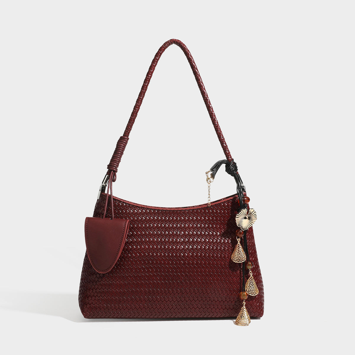 Woven-texture hobo shoulder bag in brown with braided top handle, adjustable crossbody strap, front flap pocket, and, detail