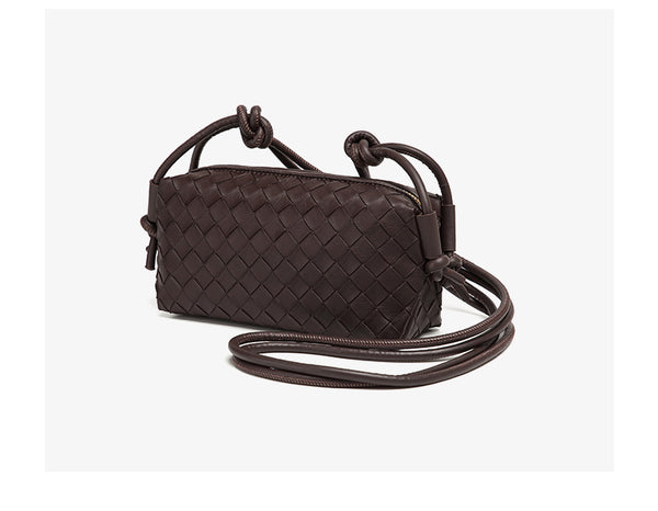 Small rectangular woven-texture mini crossbody bag with knotted rope strap and gold-tone zip closure, detail view 24