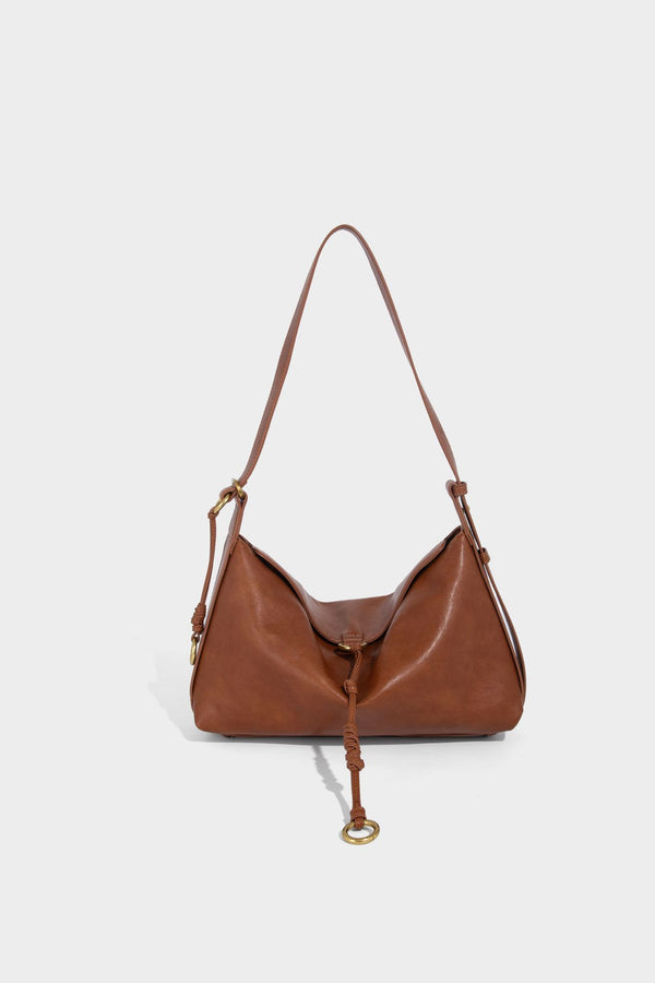 Slouchy brown leather-look shoulder bag with knotted drawcord tie closure, gold-tone ring hardware, and long adjustable