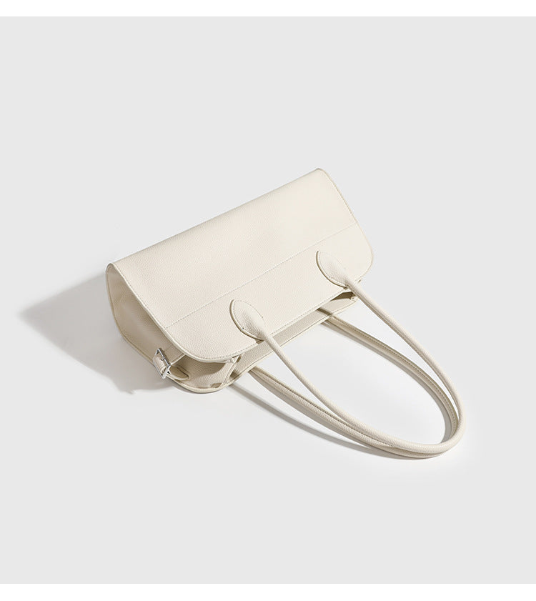 Large structured pebbled leather-look tote bag with double top handles and silver-tone hardware, detail view 11