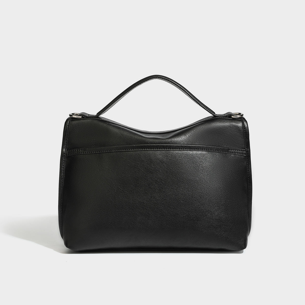 Structured rectangular flap satchel in espresso brown leather-look finish with silver-tone turn-lock buckle, top handle, and