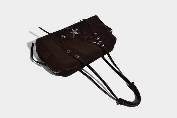 Structured rectangular matte suede-like shoulder bag with silver-tone hardware, zip closure, double top handles, and, detail
