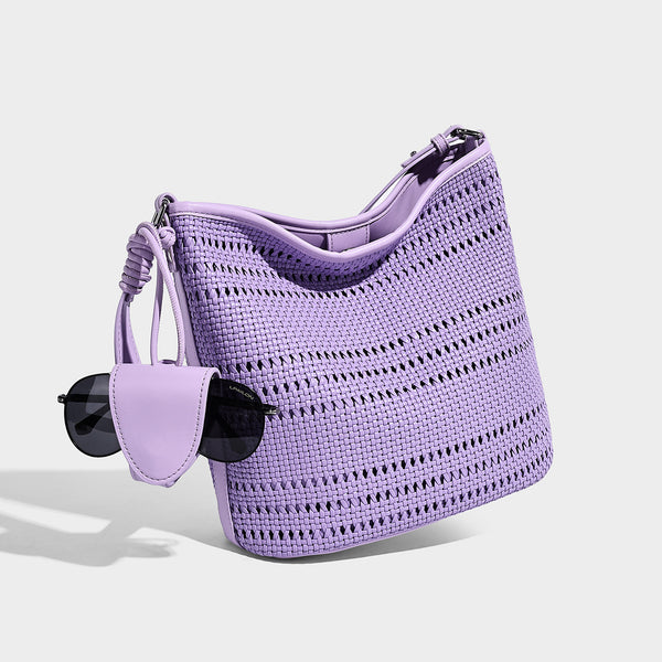 Handwoven open-weave shoulder bag with leather-look trim, knotted adjustable strap, and clip-on sunglasses sleeve pouch