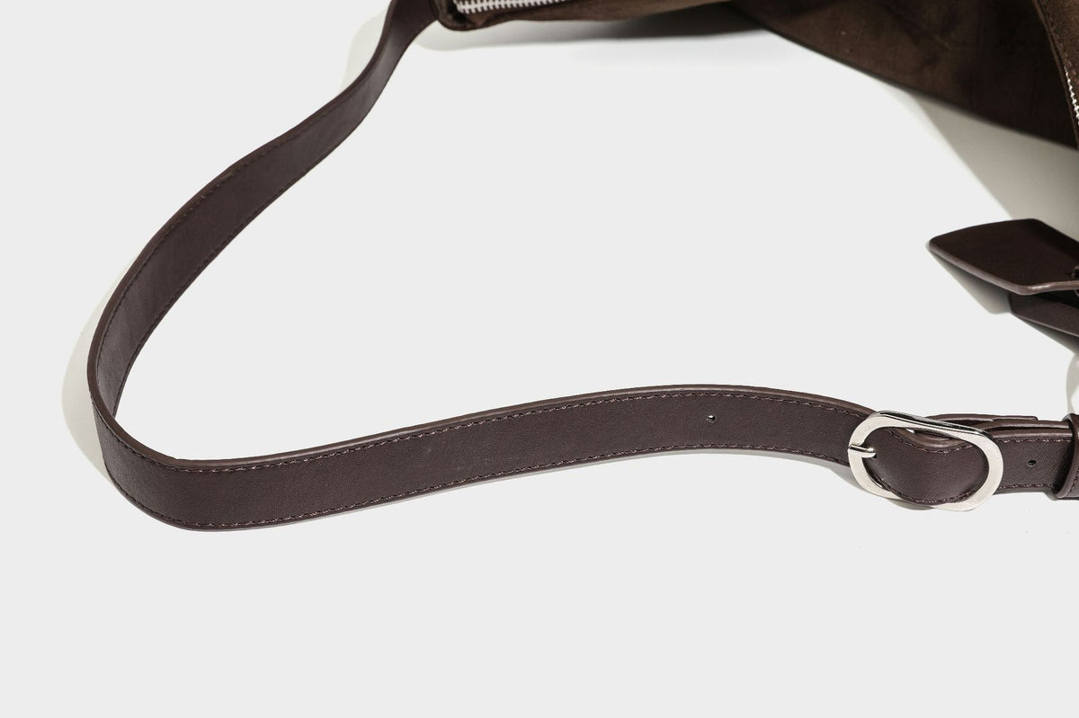 Slouchy hobo shoulder bag in matte croc-embossed leather-look finish with top zip closure and long adjustable strap, detail