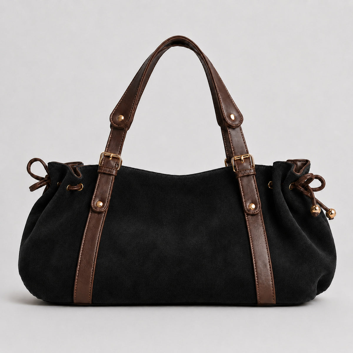 Soft suede-texture shoulder bag in brown with drawstring sides, leather-look vertical straps, gold-tone buckle hardware, and