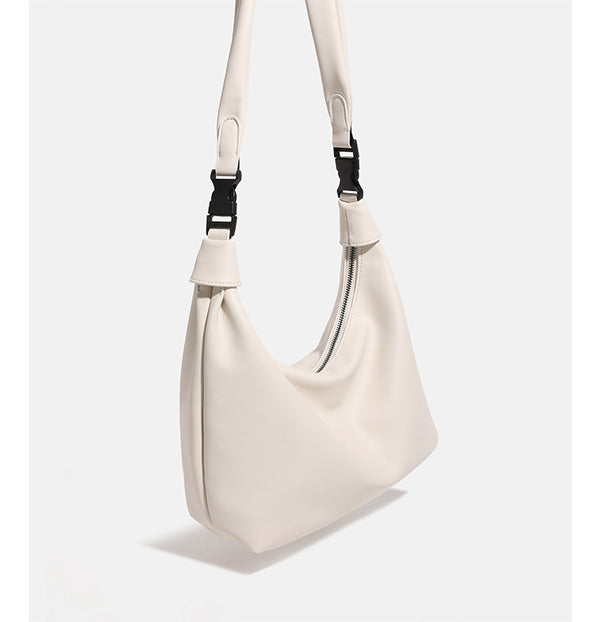 Slouchy leather-look hobo bag with knotted loop handle and top zipper closure, detail view 14