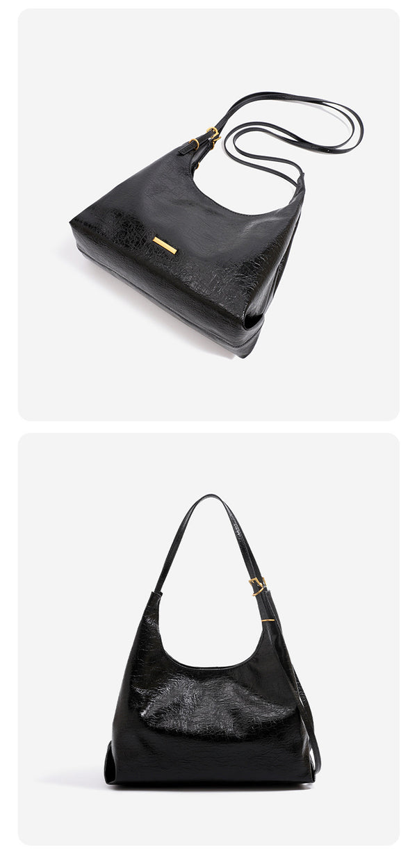 Slouchy hobo shoulder bag in crinkle high-gloss leather-look finish with gold-tone bar hardware and adjustable strap, detail