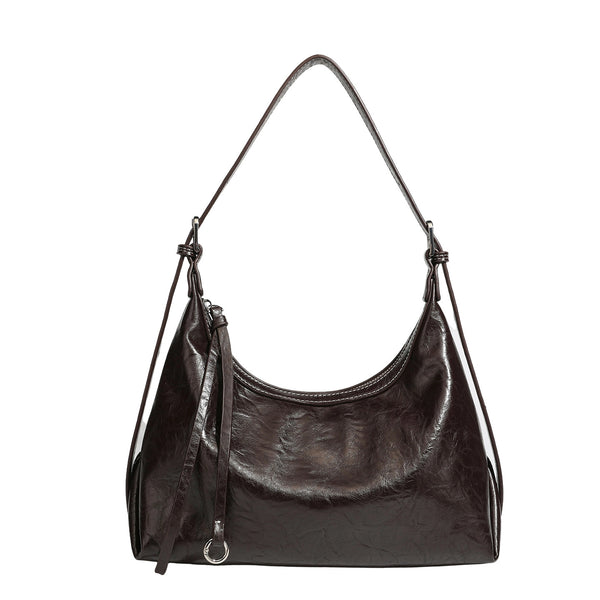 Slouchy hobo shoulder bag in glossy crinkled leather-look finish with zip-top closure and silver-tone ring hardware, detail