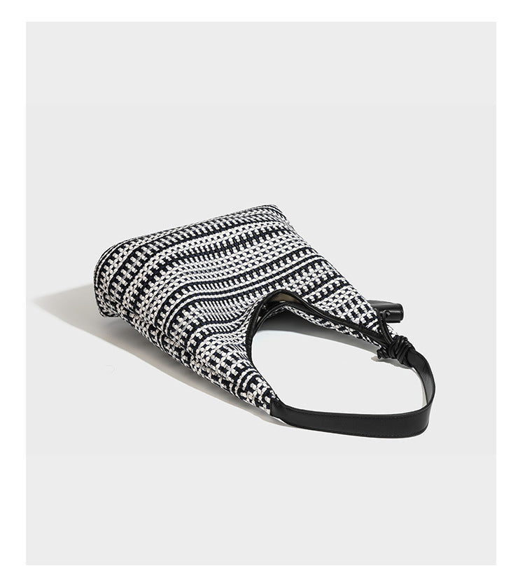 Slouchy woven stripe hobo shoulder bag with black-and-white pattern and leather-look strap, detail view 11