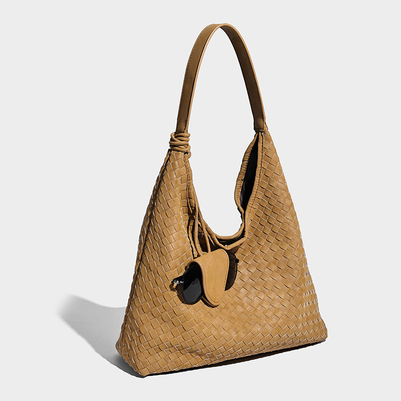 Slouchy woven hobo shoulder bag with knotted strap and matte leather-look textured finish, detail view 9