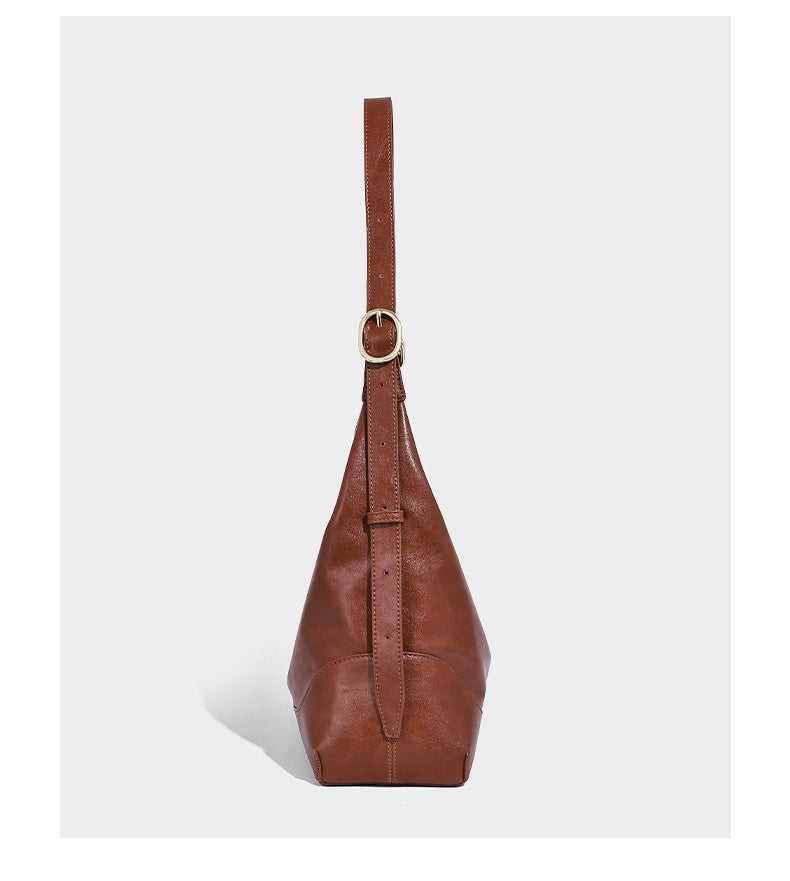 Glossy leather-look slouchy hobo shoulder bag with zip closure, gold-tone hardware, and adjustable strap, detail view 8
