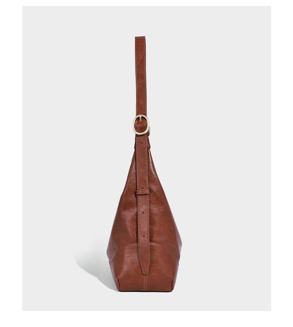 Glossy leather-look slouchy hobo shoulder bag with zip closure, gold-tone hardware, and adjustable strap, detail view 8