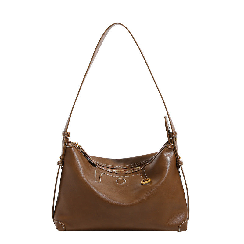 Smooth leather-look hobo bag with gold-tone ring hardware, contrast stitching, top handle and adjustable crossbody strap