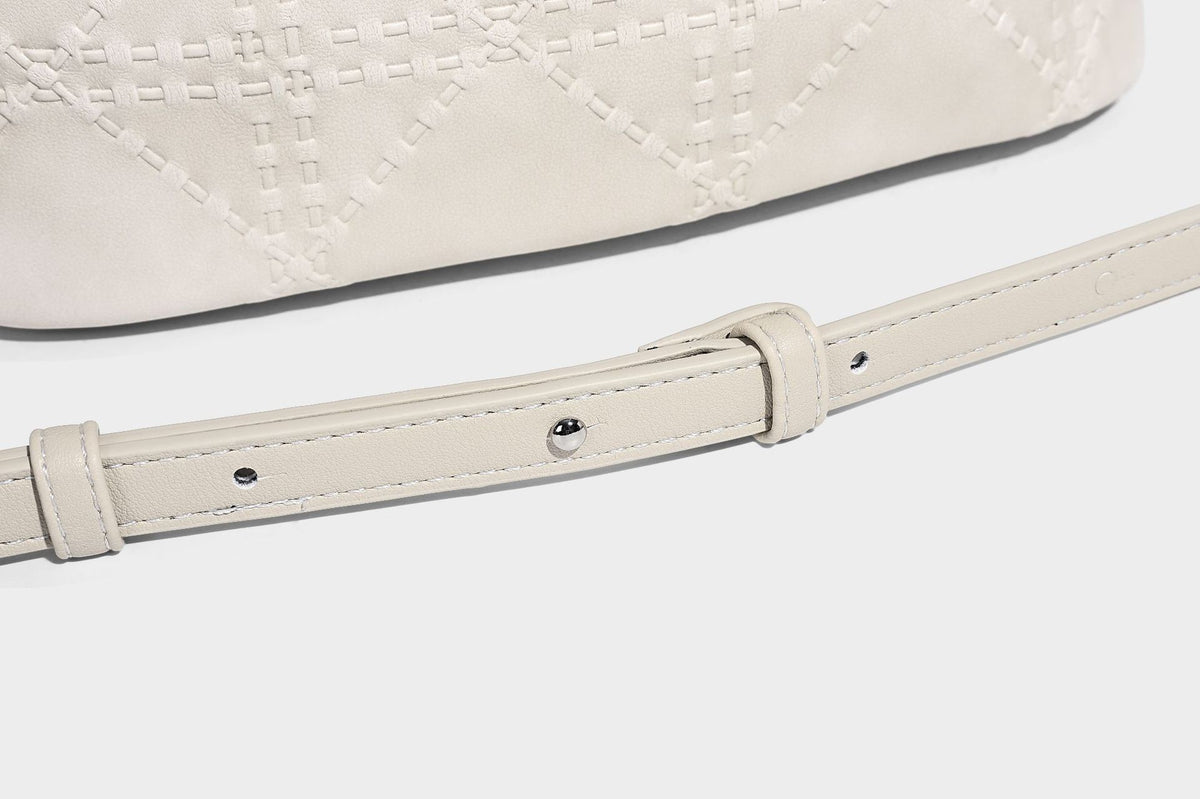 Diamond-quilted leather-look bucket shoulder bag with knotted strap accent and attached mini pouch, detail view 28
