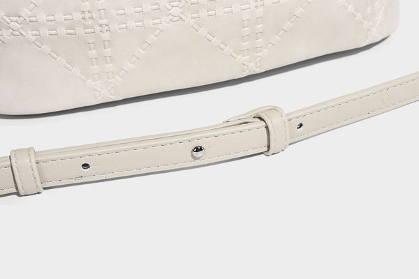 Diamond-quilted leather-look bucket shoulder bag with knotted strap accent and attached mini pouch, detail view 28