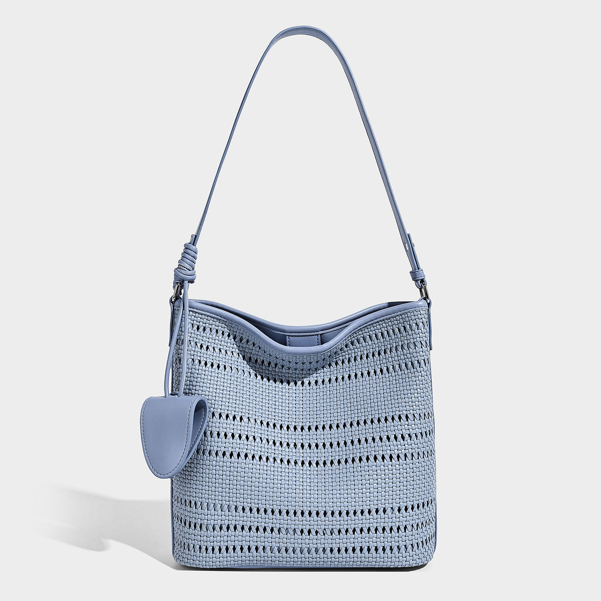 Handwoven open-weave shoulder bag with leather-look trim, knotted adjustable strap, and clip-on sunglasses sleeve pouch