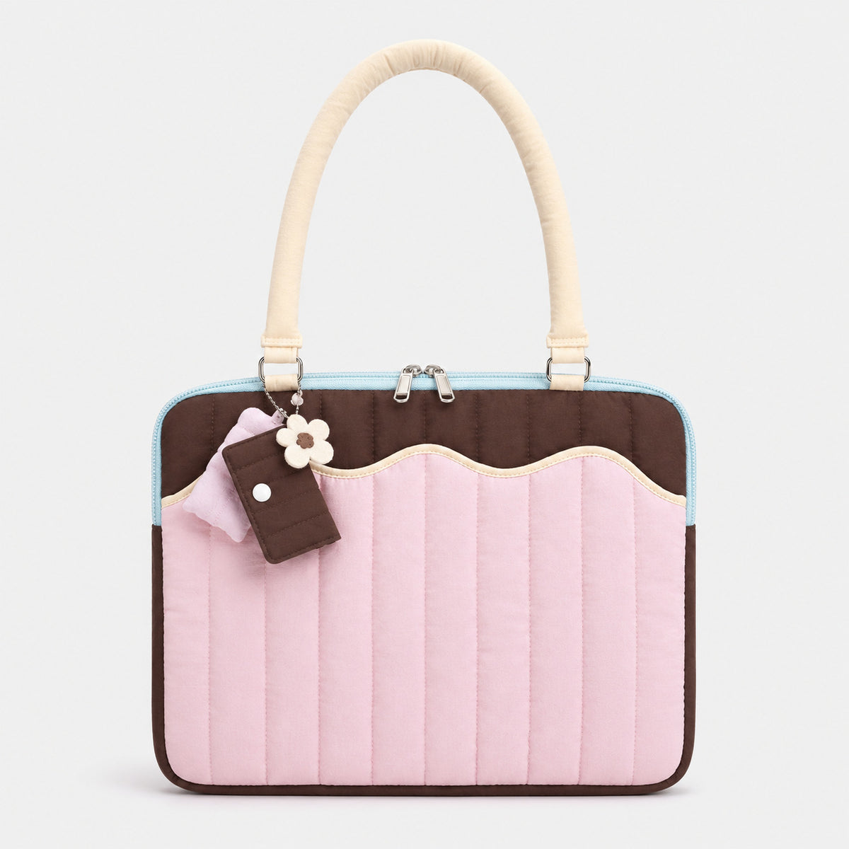 Quilted colorblock handbag with wavy scalloped front panel, padded arched top handles, and dual zip closure, detail view 7