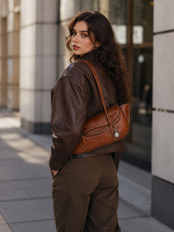Structured leather-look flap shoulder bag with contrast stitching and silver ball charm hardware, detail view 12