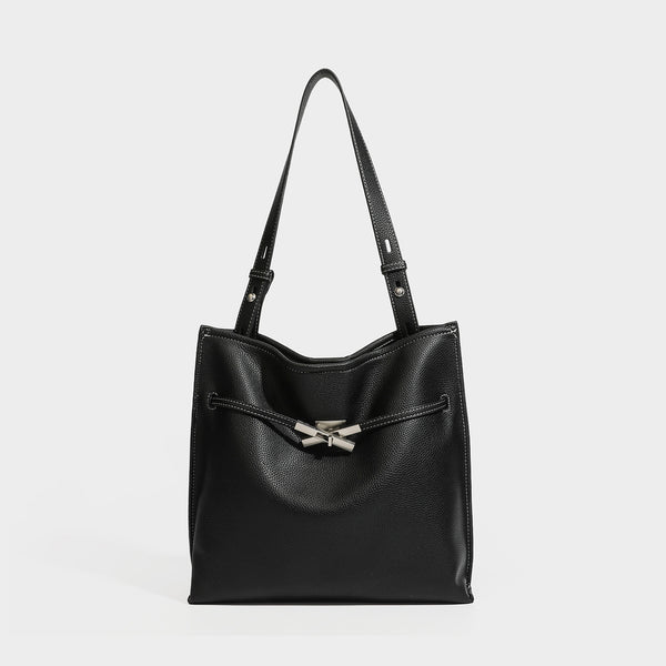 Pebbled leather-look tote bag with front toggle hardware and long shoulder strap, detail view 6
