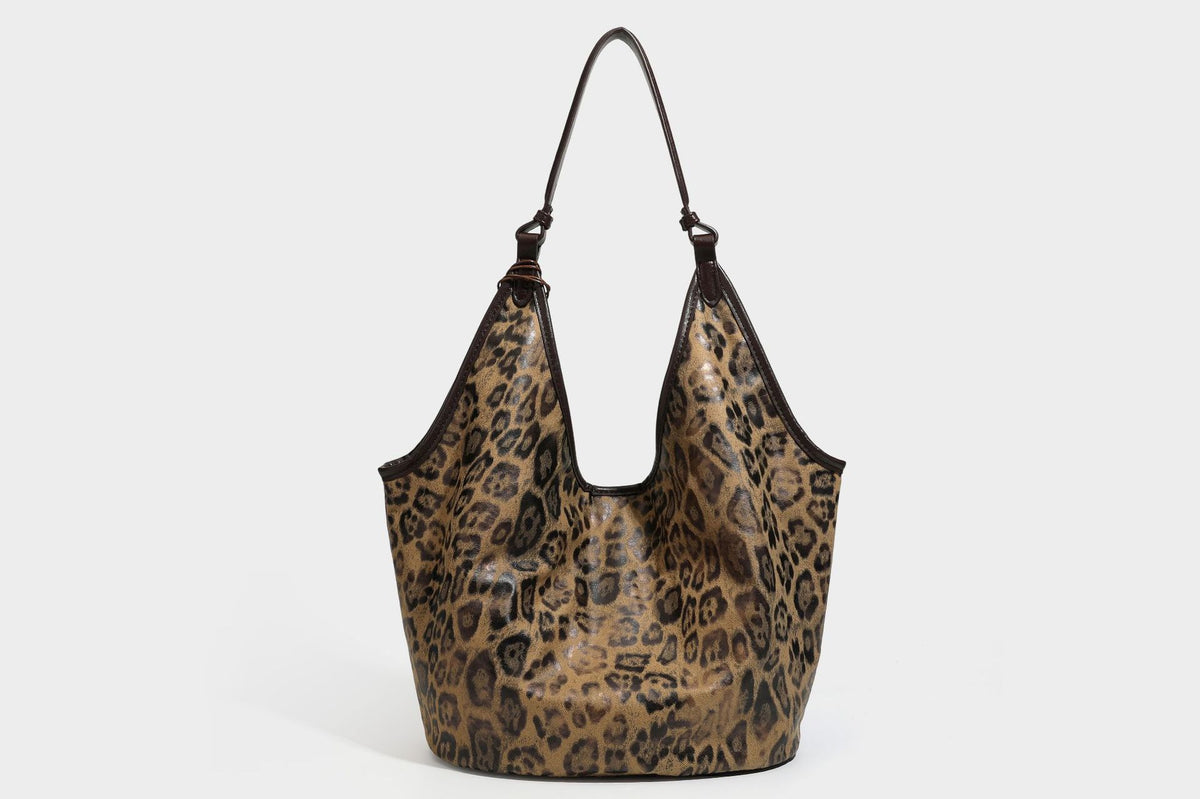 Large slouchy leopard-print shoulder tote bag with glossy tan-and-brown finish, dark brown leather-look trim, single