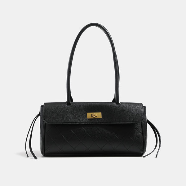 Structured quilted diamond-stitch baguette handbag with gold-tone turn-lock closure and dual top handles, front view