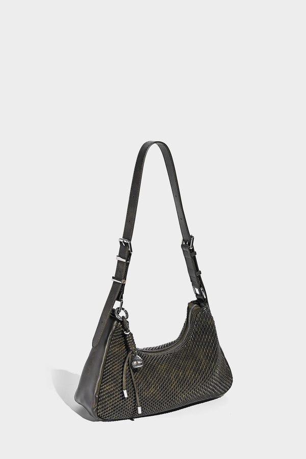 Woven crescent hobo shoulder bag with smooth side panels, zip-top closure, silver-tone charm hardware, and adjustable, detail