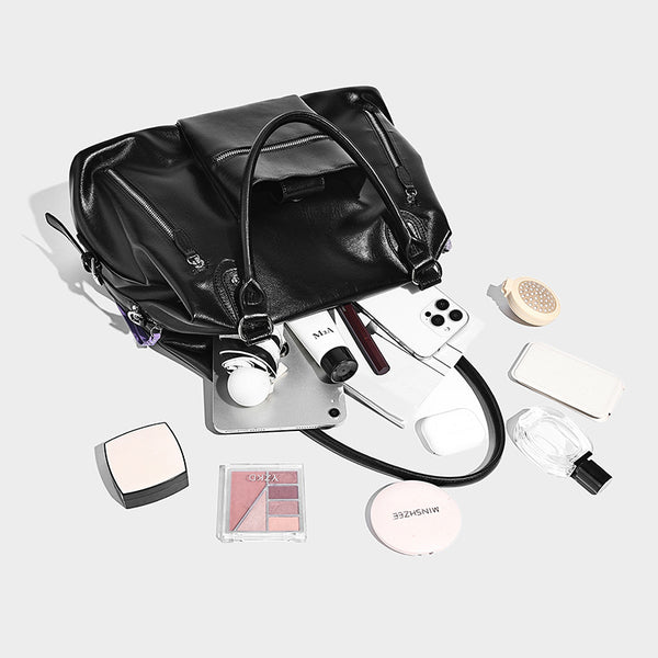 Glänzende strukturierte Henkeltasche im Tote-Stil mit zwei Tragegriffen, abnehmbarem Umhängeriemen, Reißverschlusstaschen auf der Vorderseite und Beschlägen in Silberoptik