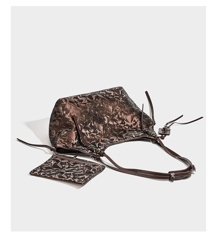Slouchy crinkle-finish shoulder tote bag with silver hardware and attached zip pouch, detail view 9