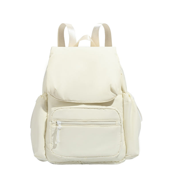 Soft matte nylon flap backpack with front zip pocket and side drawcord pockets, detail view 5
