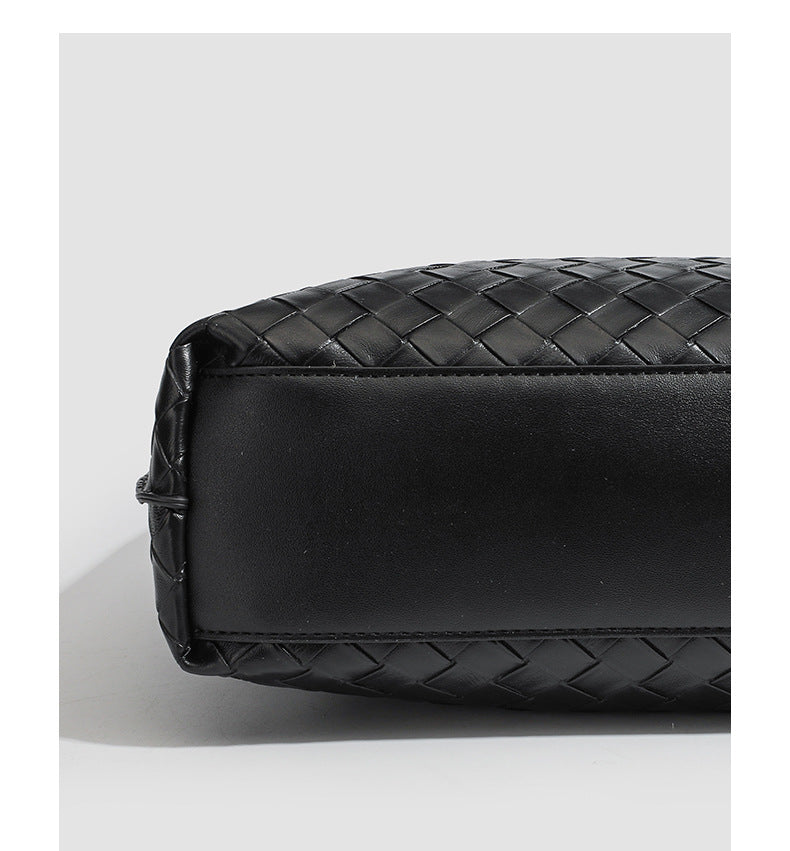 Large black woven leather-look tote bag with twin shoulder straps and matching inner pouch, detail view 12