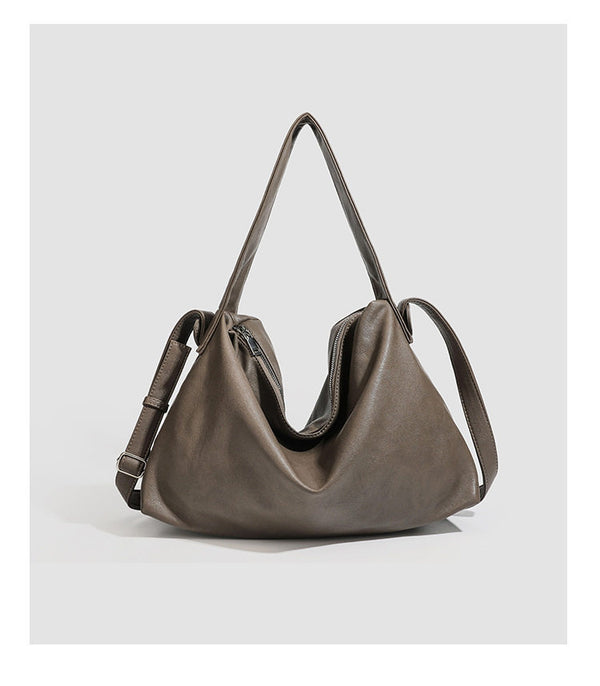 Slouchy leather-look hobo shoulder bag with top zipper and silver-tone hardware, detail view 10