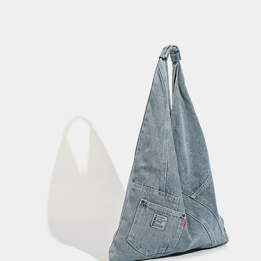 Washed denim slouch tote bag with patch pocket and contrast stitching, detail view 3