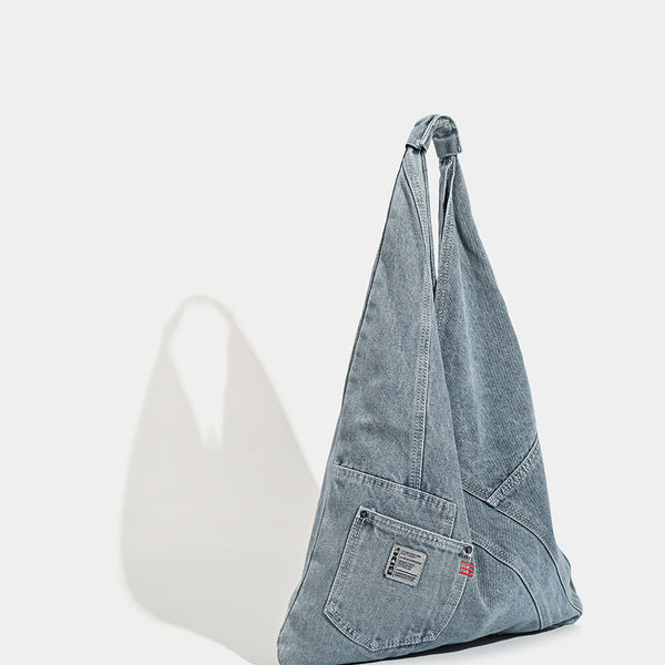 Washed denim slouch tote bag with patch pocket and contrast stitching, detail view 3