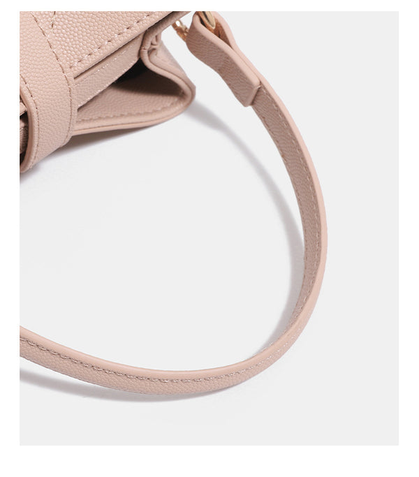 Mini diamond-quilted pebbled-finish bucket bag with gold-tone turn-lock closure and top handle, detail view 15
