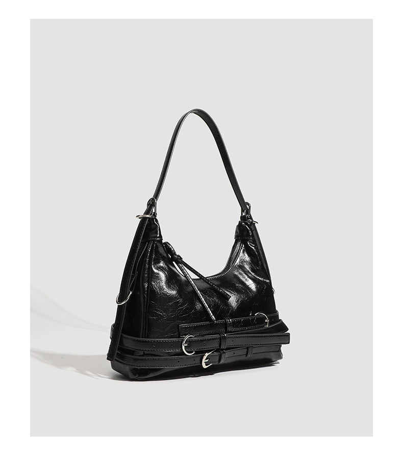Slouchy hobo shoulder bag in glossy crinkled leather-look finish with silver-tone buckle hardware and slim adjustable strap