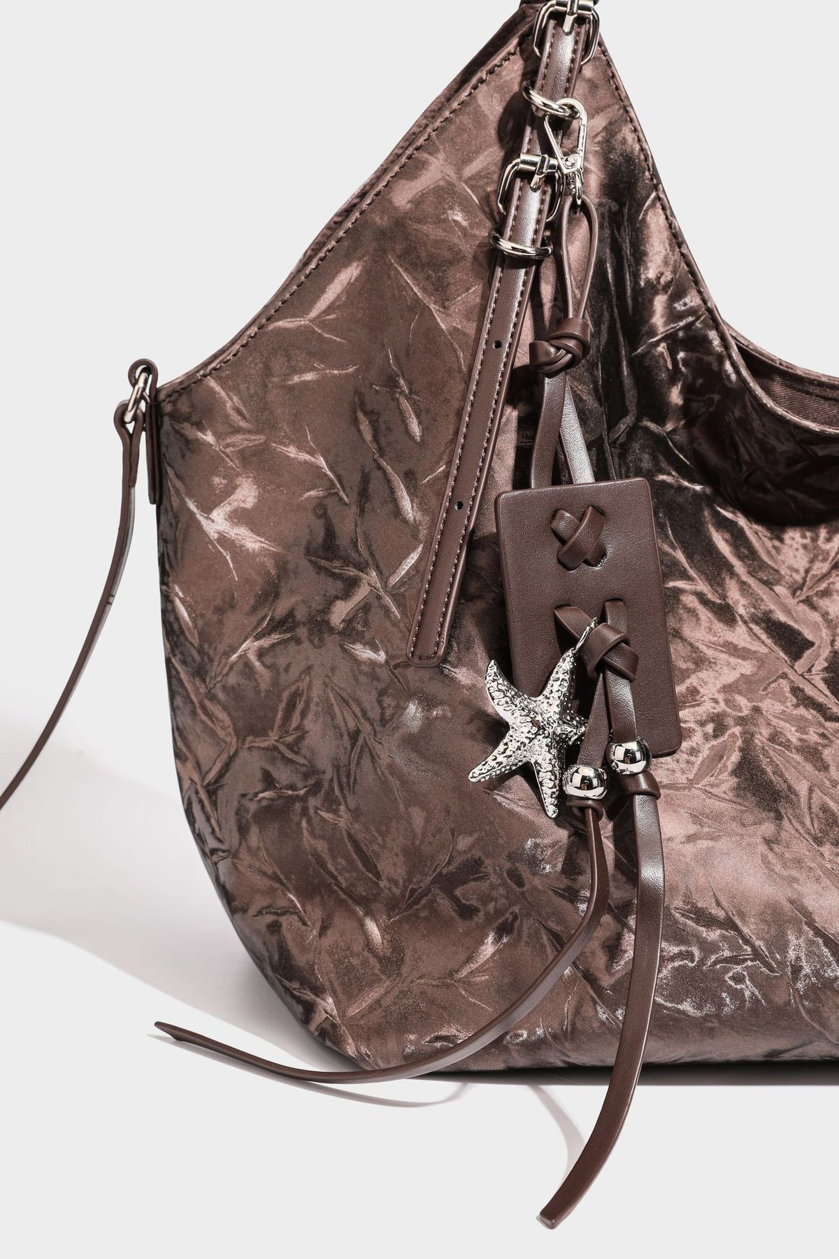Slouchy crinkle-finish shoulder tote bag with silver hardware and attached zip pouch, detail view 27