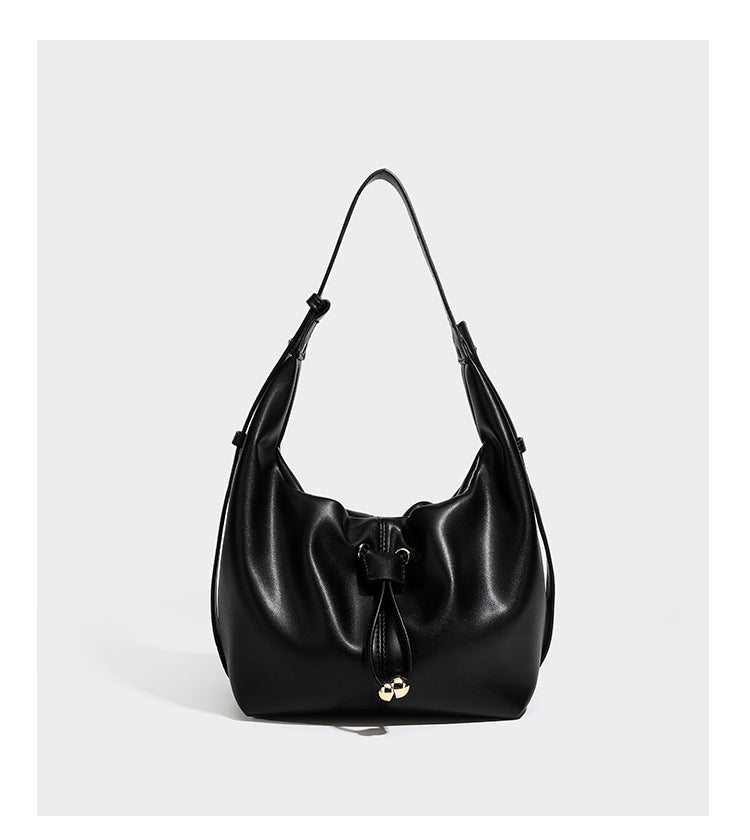 Slouchy hobo bag with smooth leather-look finish, drawstring cinch closure, and gold-tone bead hardware, detail view 12