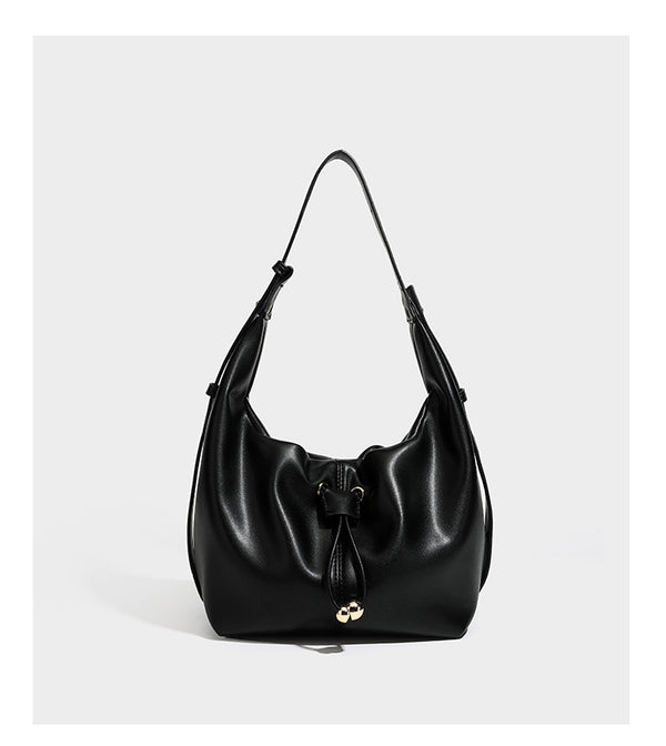 Slouchy hobo bag with smooth leather-look finish, drawstring cinch closure, and gold-tone bead hardware, detail view 12