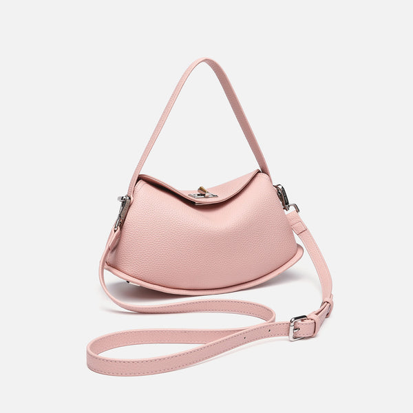 Pebbled leather-look half-moon saddle bag with turn-lock flap closure, top handle, and detachable crossbody strap, detail