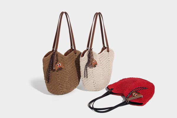 Woven crochet open-top shoulder tote bag with slim brown leather-look straps and braided charm accent, detail view 19