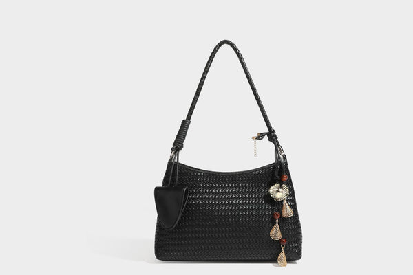 Woven-texture hobo shoulder bag in brown with braided top handle, adjustable crossbody strap, front flap pocket, and, detail
