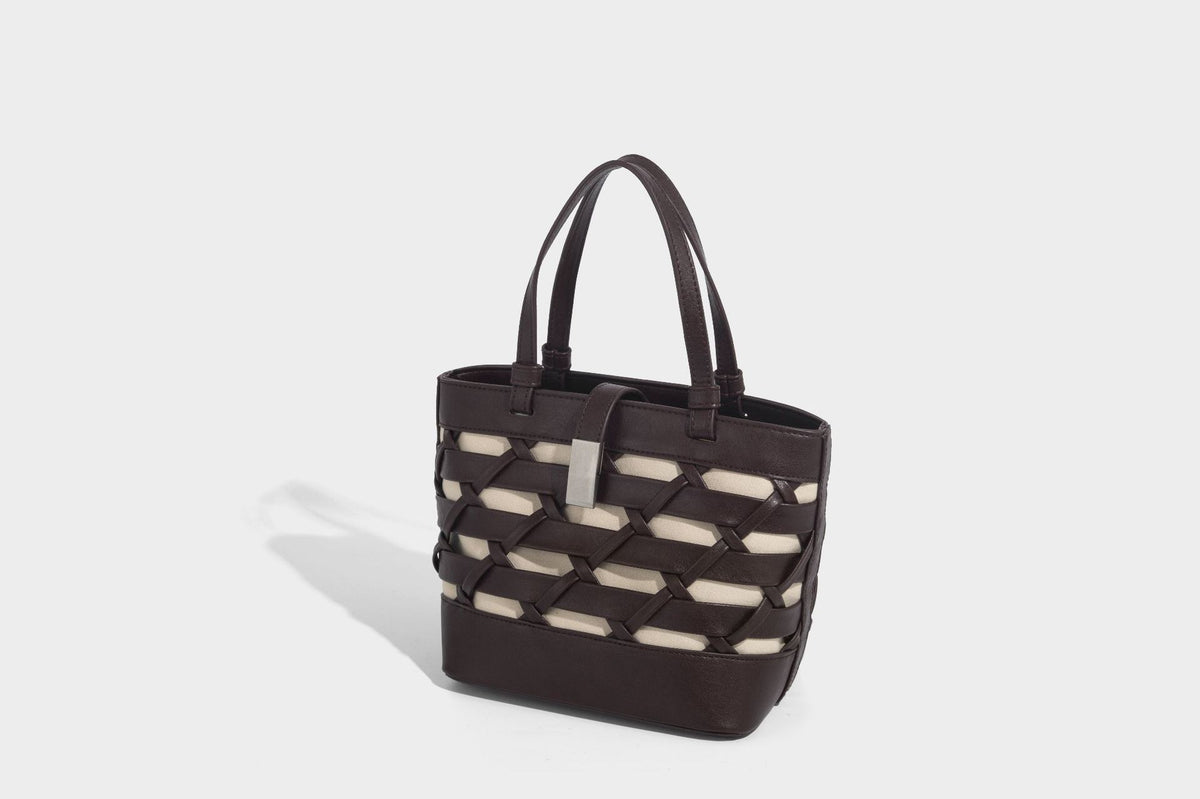 Structured woven lattice tote bag with cream lining, dual top handles, detachable crossbody strap, and silver-tone hardware