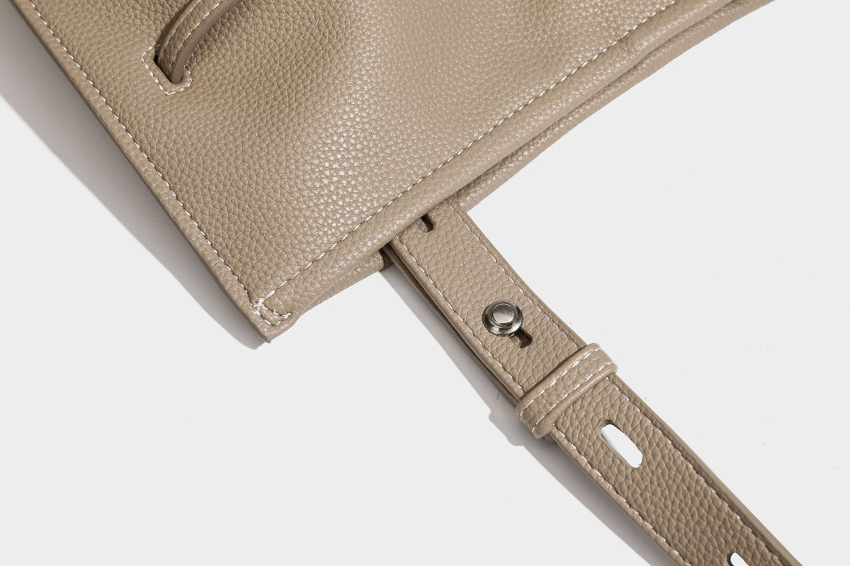 Pebbled leather-look tote bag with front toggle hardware and long shoulder strap, detail view 29